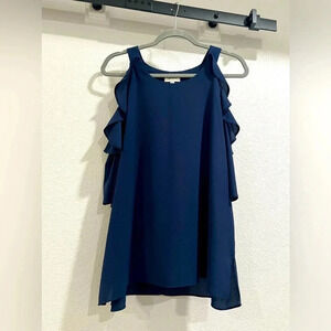 Beautiful rich navy blouse. Loose fit with cold shoulder ruffle detail. …